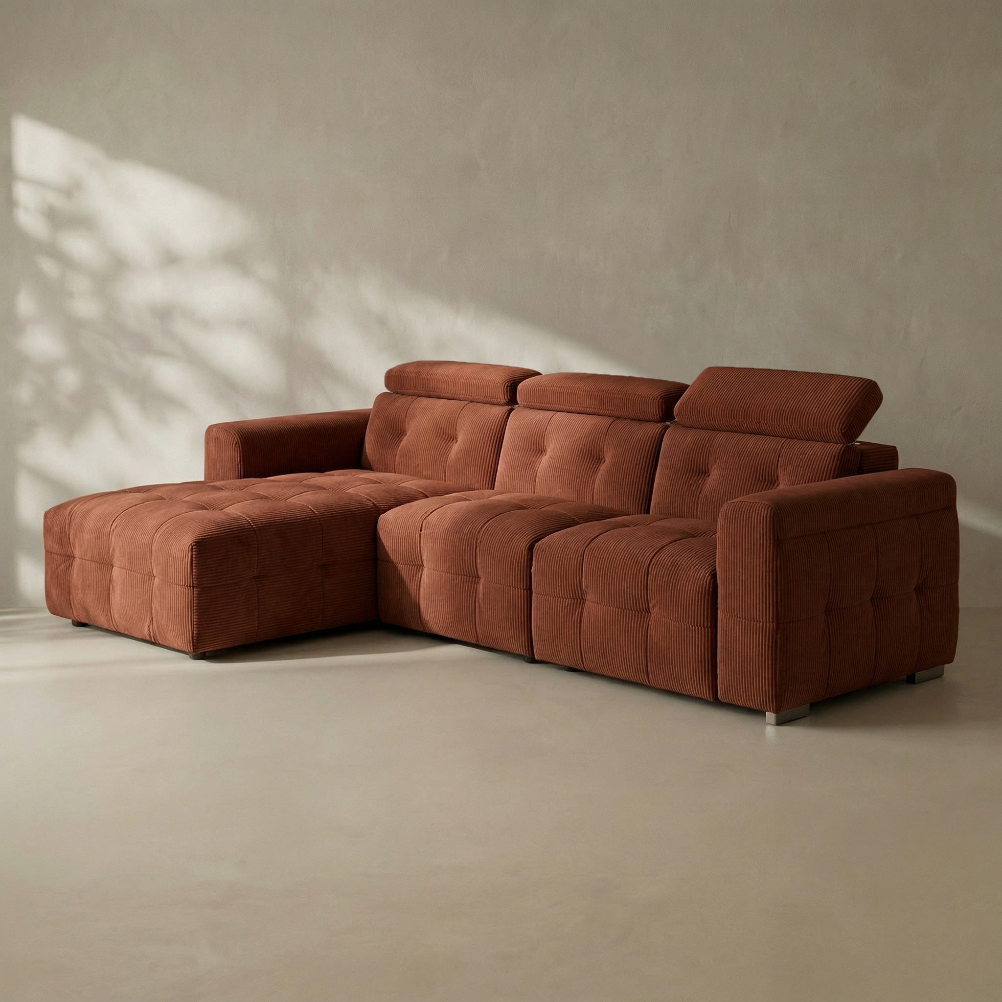 Brown sectional sofa in a minimalistic room with soft lighting