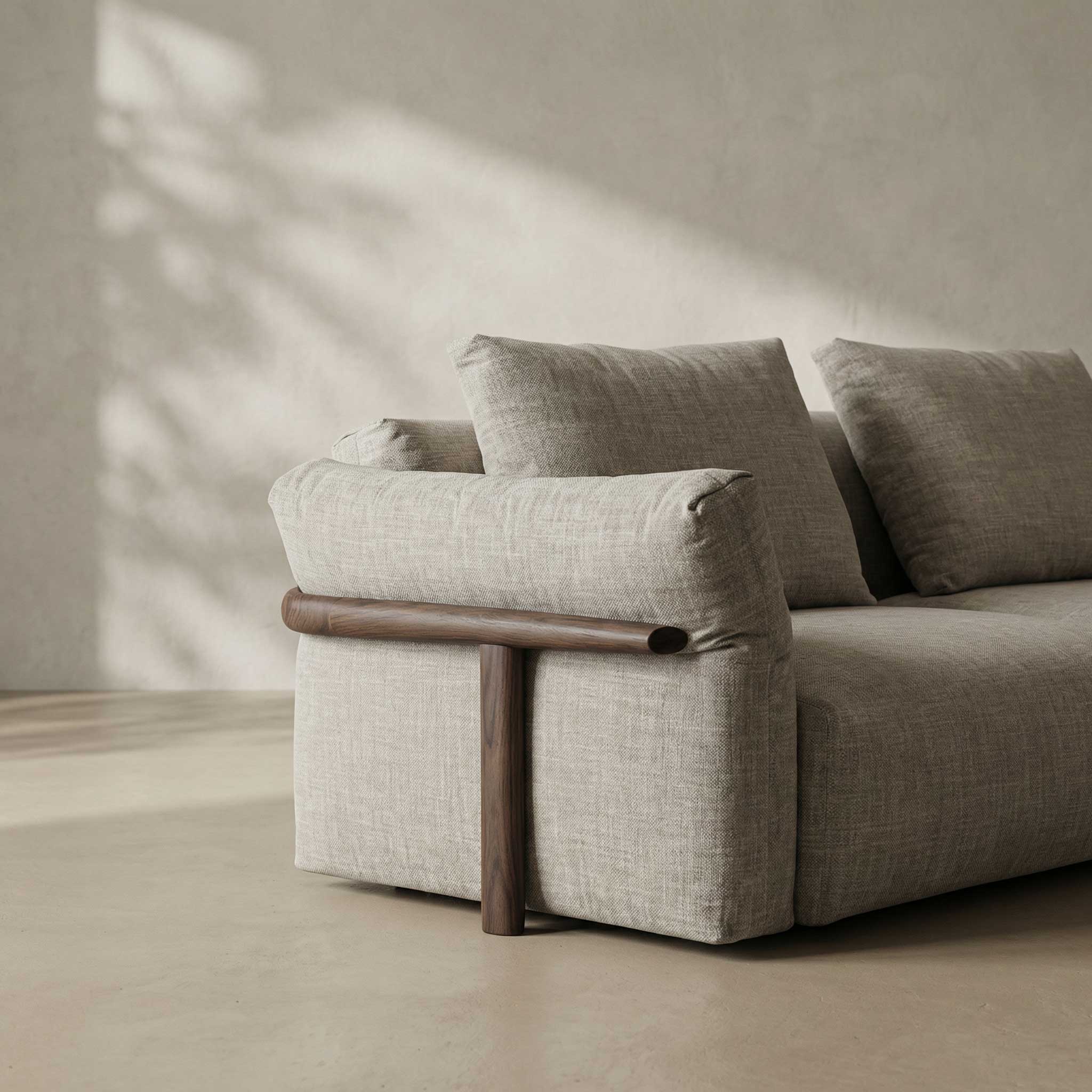 Gray sofa with wooden armrests in a minimalistic room