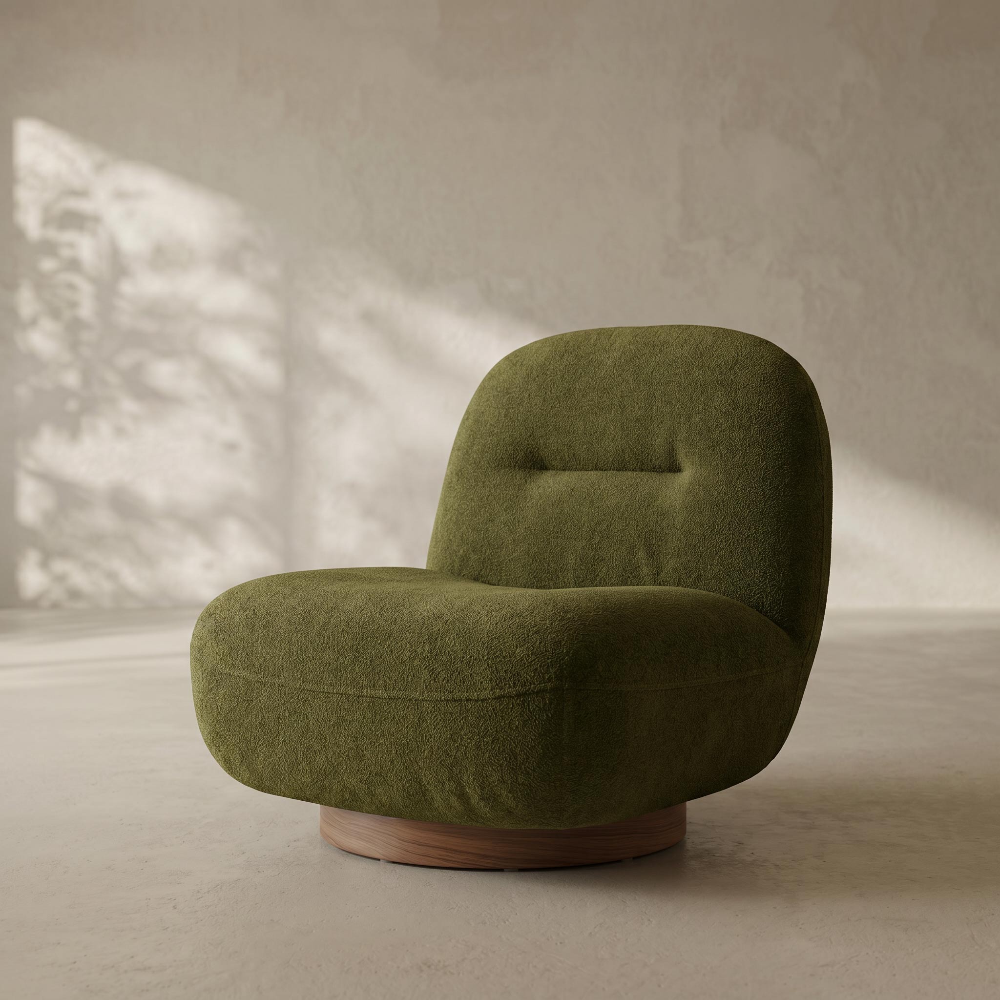 An olive green upholstered accent chair with a rounded, cloud-like silhouette and a circular wooden base, set against a textured beige wall with soft window light shadows.