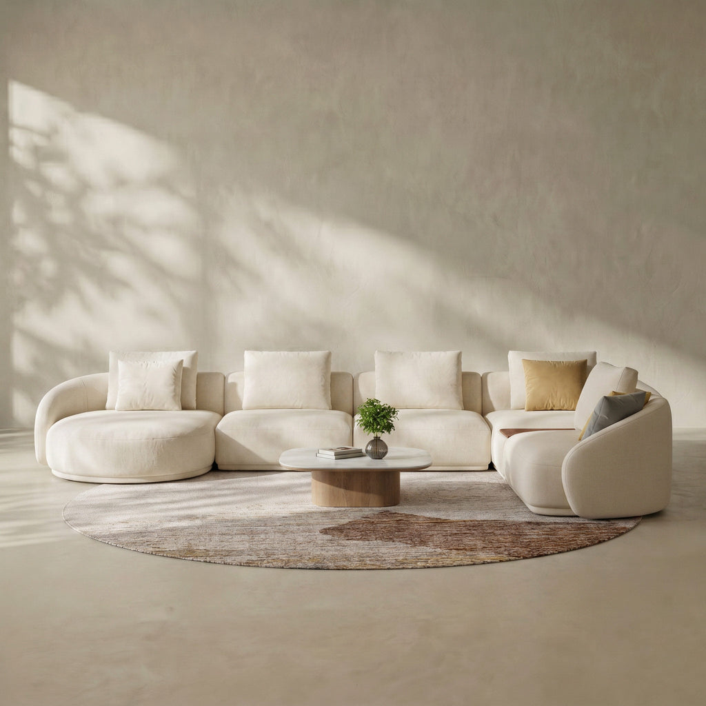 Modern beige sectional sofa in a minimalistic room with soft lighting