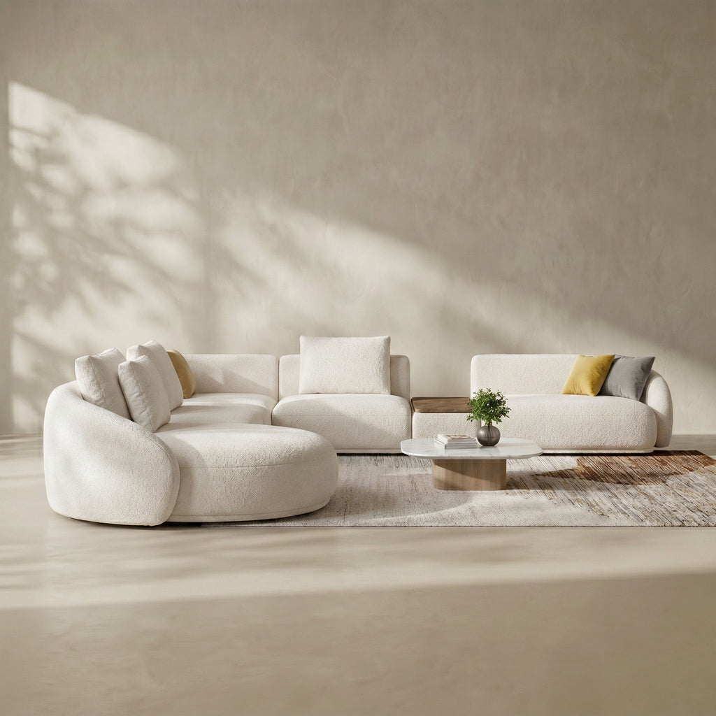 Modern living room with a white sofa and coffee table in a neutral setting