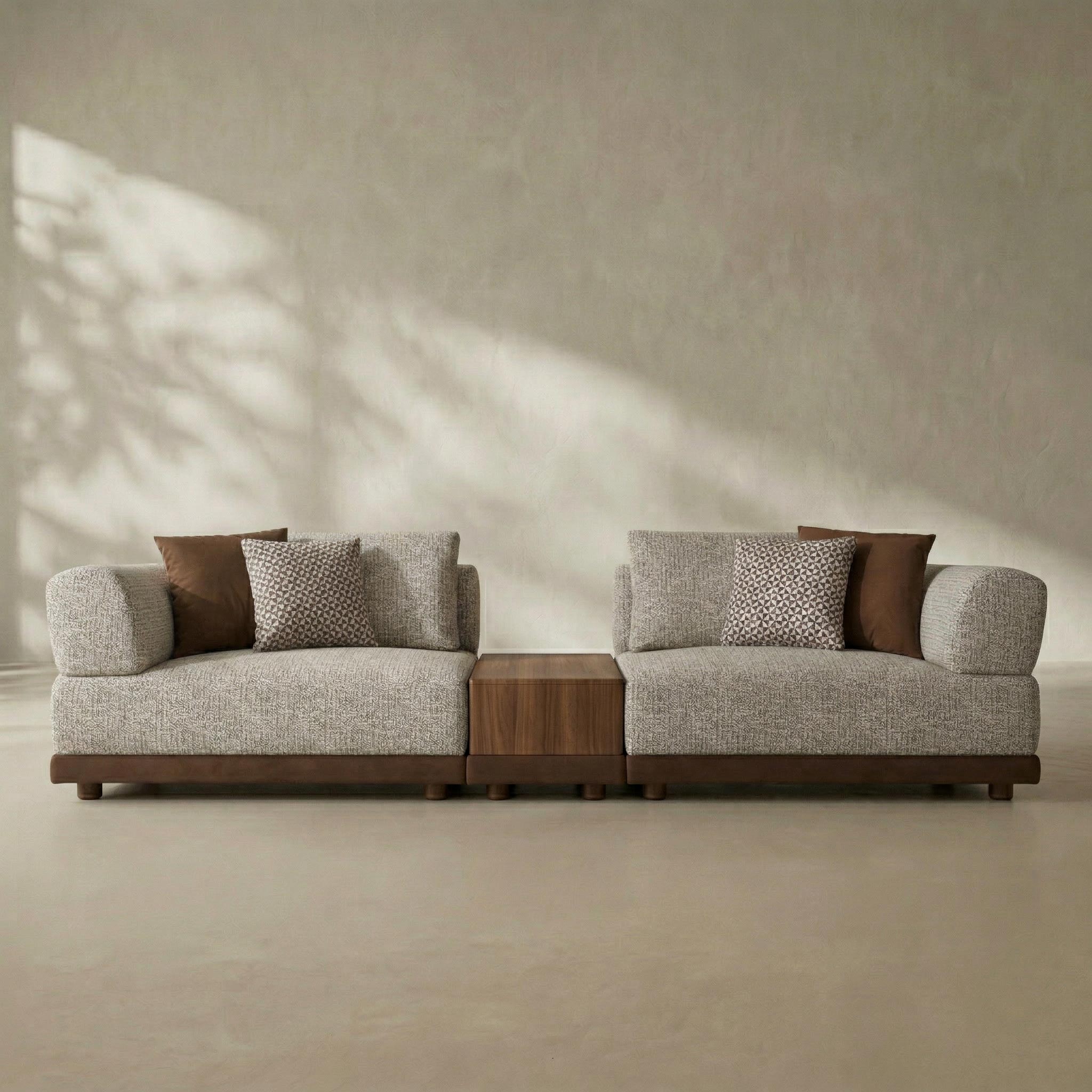 Modern sofa with wooden accents against a neutral wall