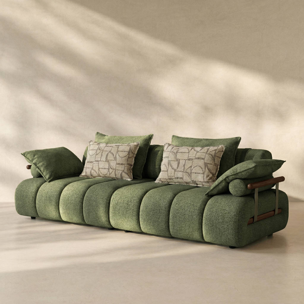 Green sofa with patterned cushions on a beige background