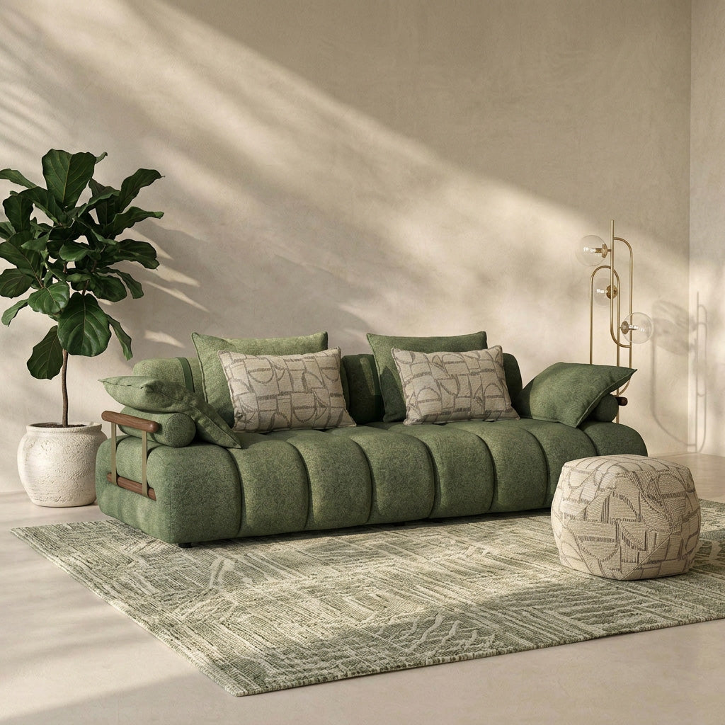 Green sofa in a living room with a plant and rug