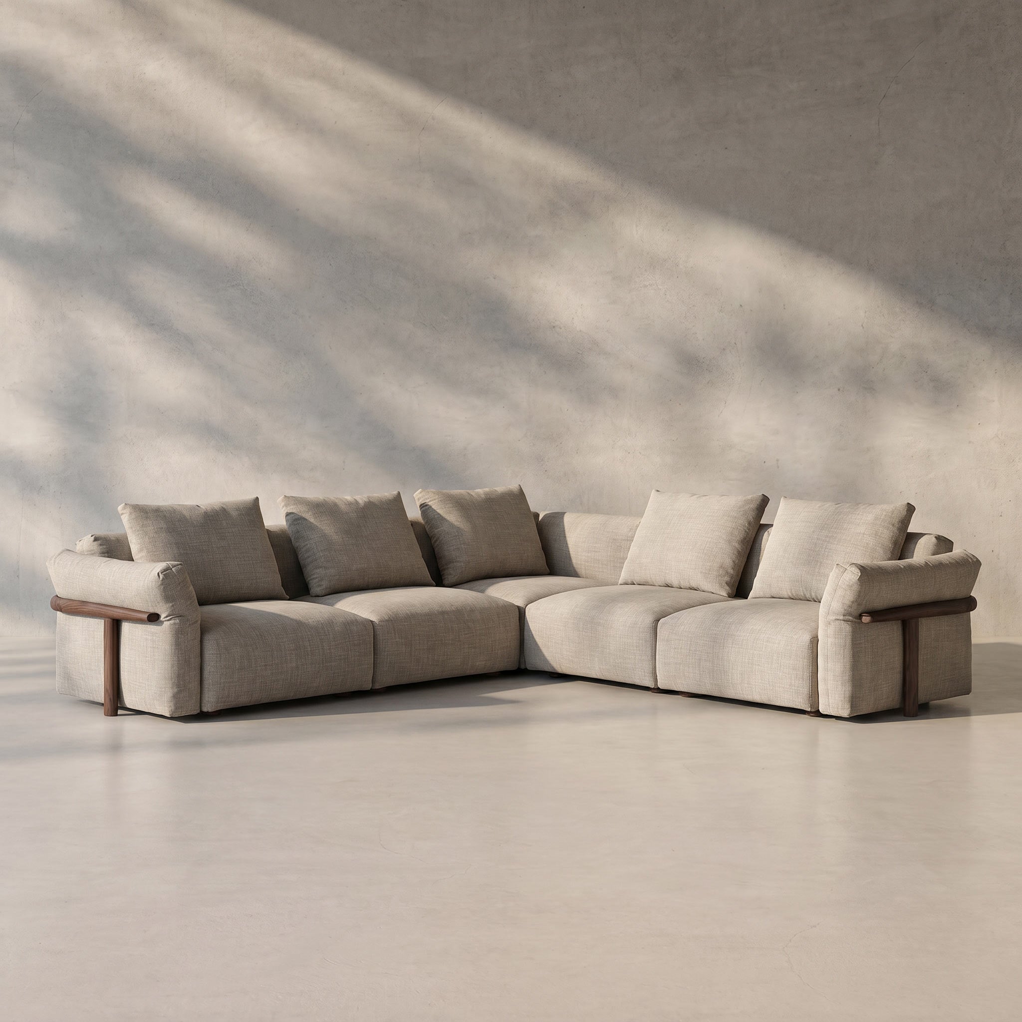 Beige sectional sofa in a minimalistic room with soft lighting